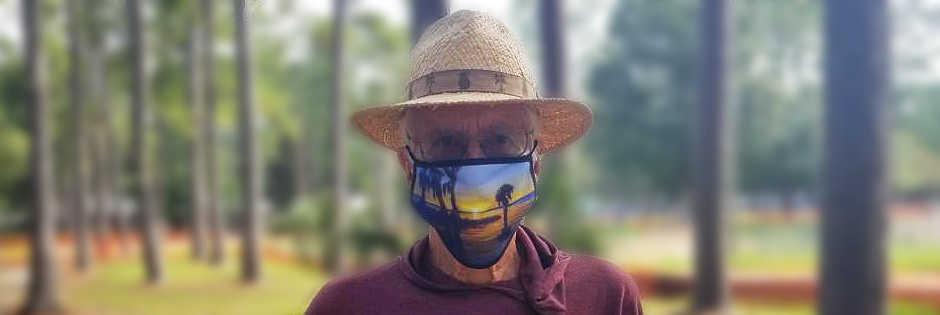 Guy wearing Ernest Lee Art Print face mask