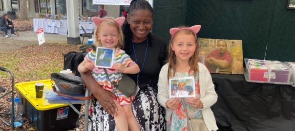 Mrs. Gloria Lee with happy customers at the Thornebrook Spring Arts Festival in Gainesville, Fla., March 2-3, 2024.